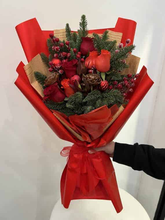 Festive Floral Elegance: Luxurious Rose Pine Bouquet